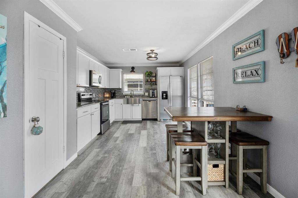 The vinyl plank floors not only add a touch of elegance but are also designed to withstand the unique demands of coastal living, making them a perfect choice.
