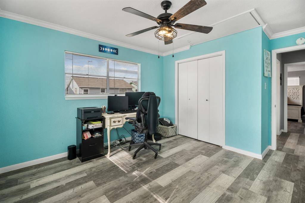 Bedrooms feature ceiling fans and ample closet space.