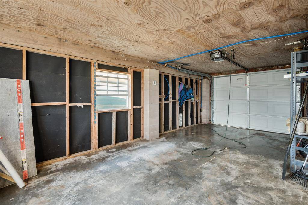 Interior of the ground floor houses a 2 car garage and flex space.