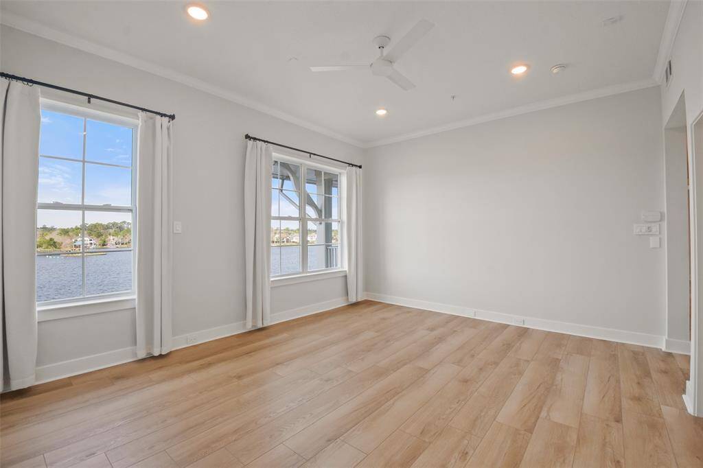 The luxurious Owners Suite is tucked away with a large walk-in closet and ensuite bathroom. The flooring, lighting and overhead fan have all been updated!