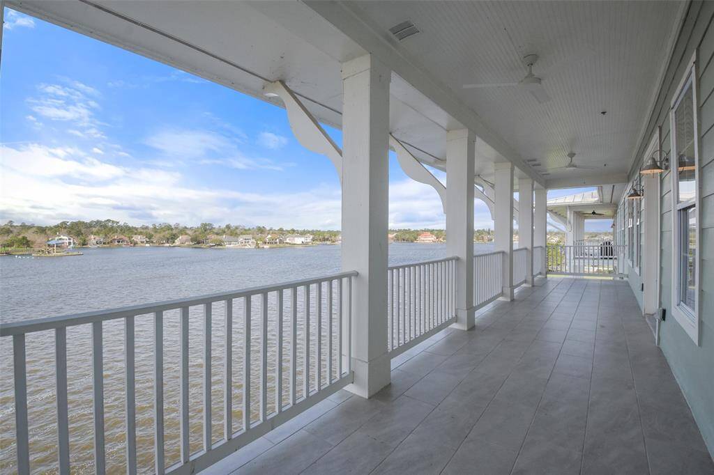 This top floor balcony offers incredible views and boasts plenty of room for all your outdoor furniture and grill. The fans and light fixtures were just updated and the tile flooring is recent too!