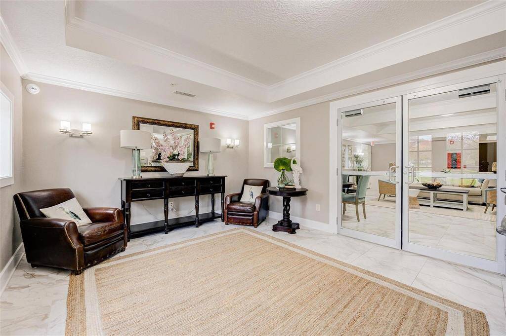 Breezy Way Lobby Entrance with seating has controlled access and houses the mailbox area.