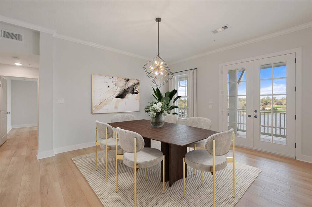 The lovely dining area has a front row seat to Lake Woodlands and has balcony access through double doors. Ample space is provided to entertain a large group. It is also located right by the kitchen for convenience. *Virtually staged