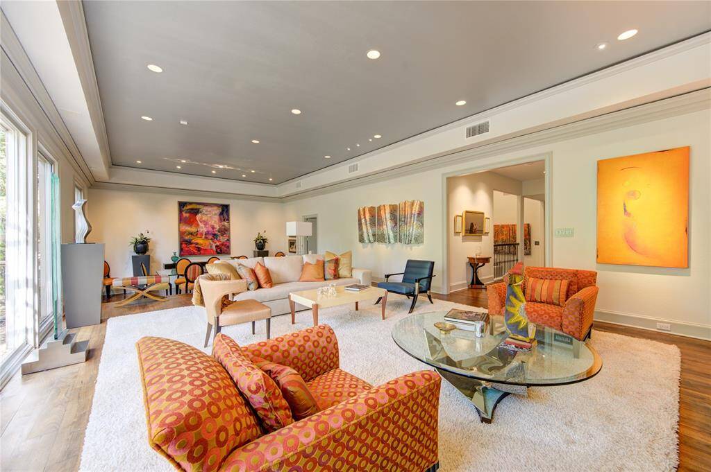 Another view of the living room features a  beautiful mix of contemporary and traditional feel. The walls allow for plenty of fabulous art display. Ceiling has a special designer touch to incorporate this elegant style.