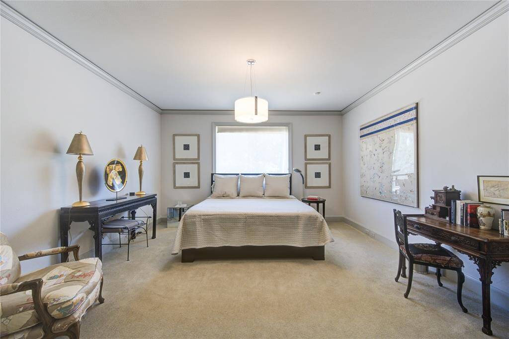 2nd bedroom. It well-lit featuring space for a king size bed and more. 2 nice size closets not shown in photo. Neutral tones and classic elements create a serene place to unwind and relax.