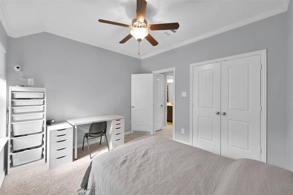 Secondary bedroom #1 with large closet & high ceilings