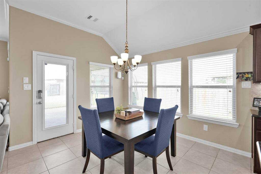 Breakfast room with elegant lighting and again, so many windows!