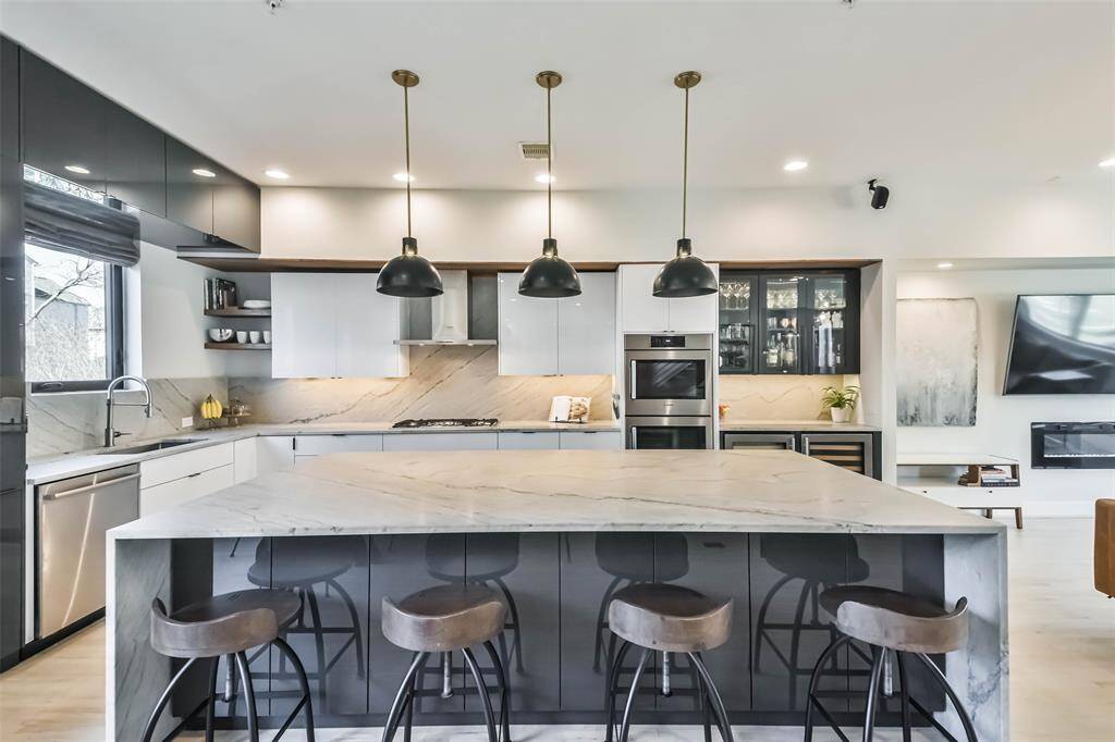 Stunning modern kitchen with opulent design and grand island- a culinary inspiration!