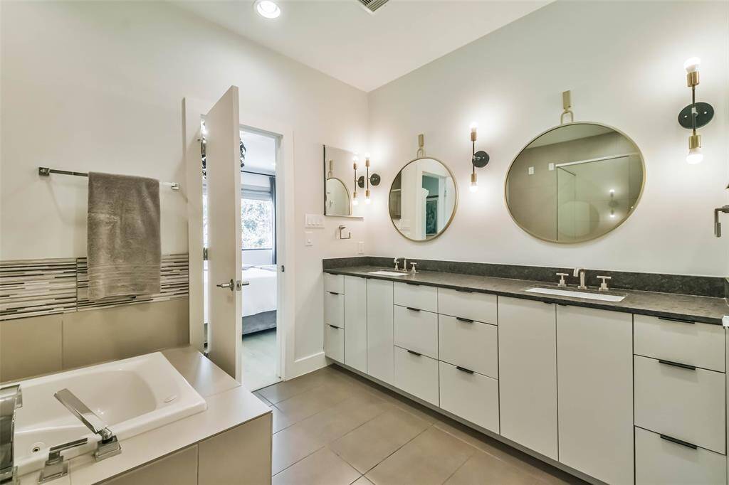 Double sinks, floating mirrors and tons of storage and counter space