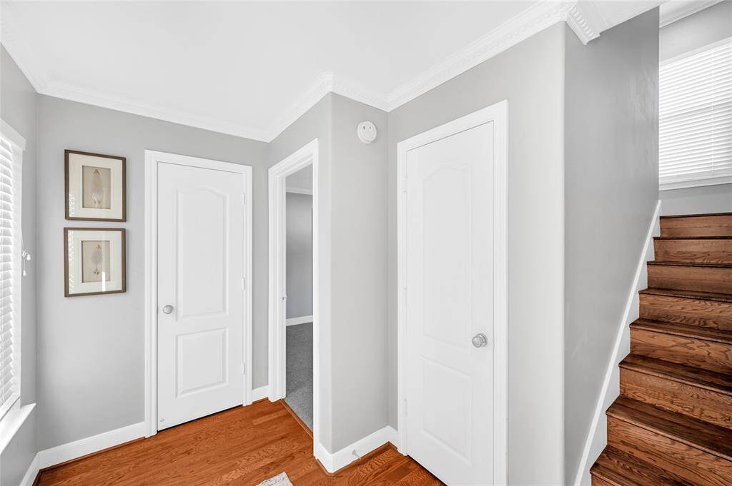 The entry hall includes a generous storage closet as well as a coat closet. The 2 car garage is to the right of the stairs.