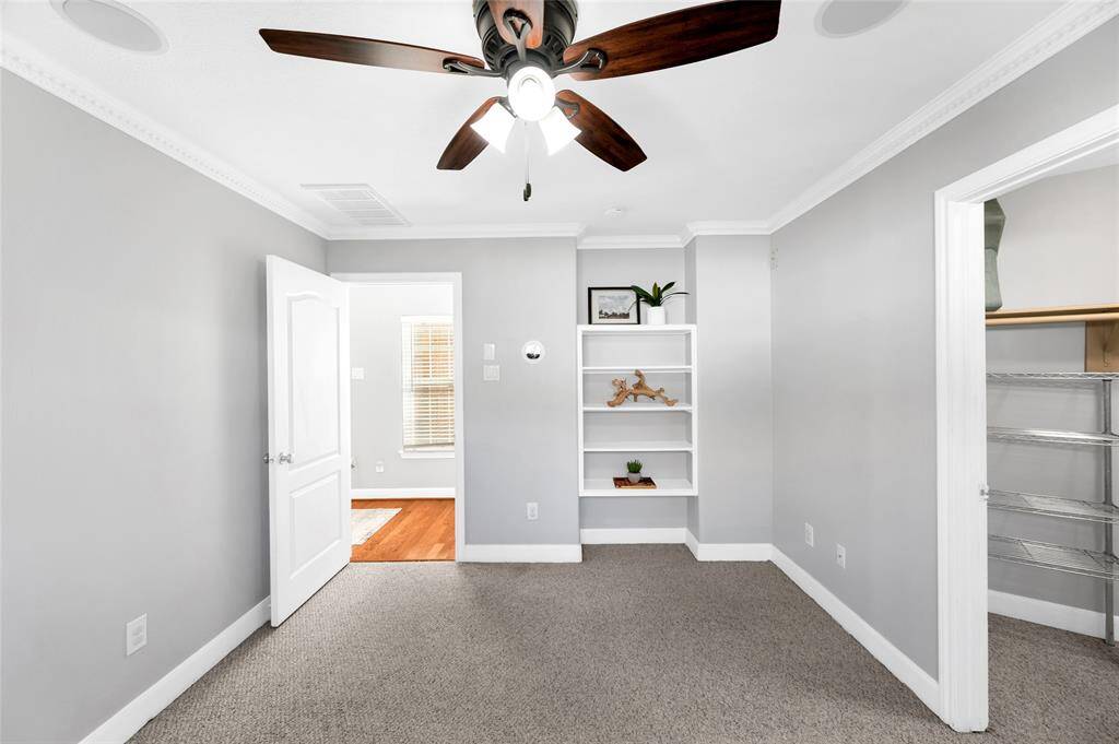 The ground floor bedroom with bath en suite and a walk in closet. It could be a guest suite or an office space.