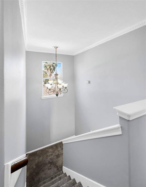 What a dramatic touch - the chandelier in the stairway leading to the 3rd floor.