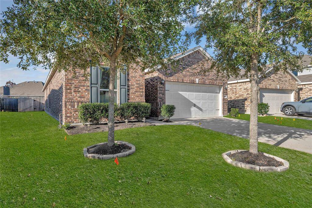 Inviting front yard with lush greenery.