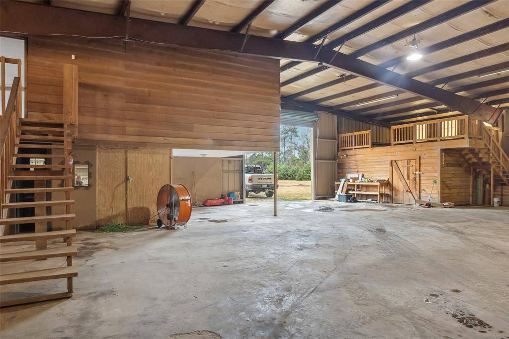 The stairs lead up to the office and additional storage areas.