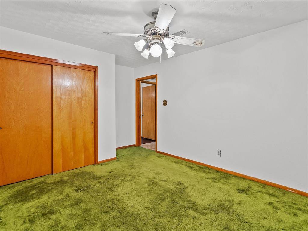 Second of three secondary hallway bedrooms.