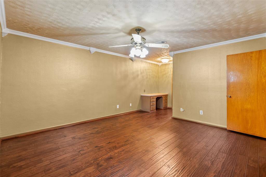 Yet another custom built-in found in the primary bedroom, steps from a walk-in closet and the primary bath.