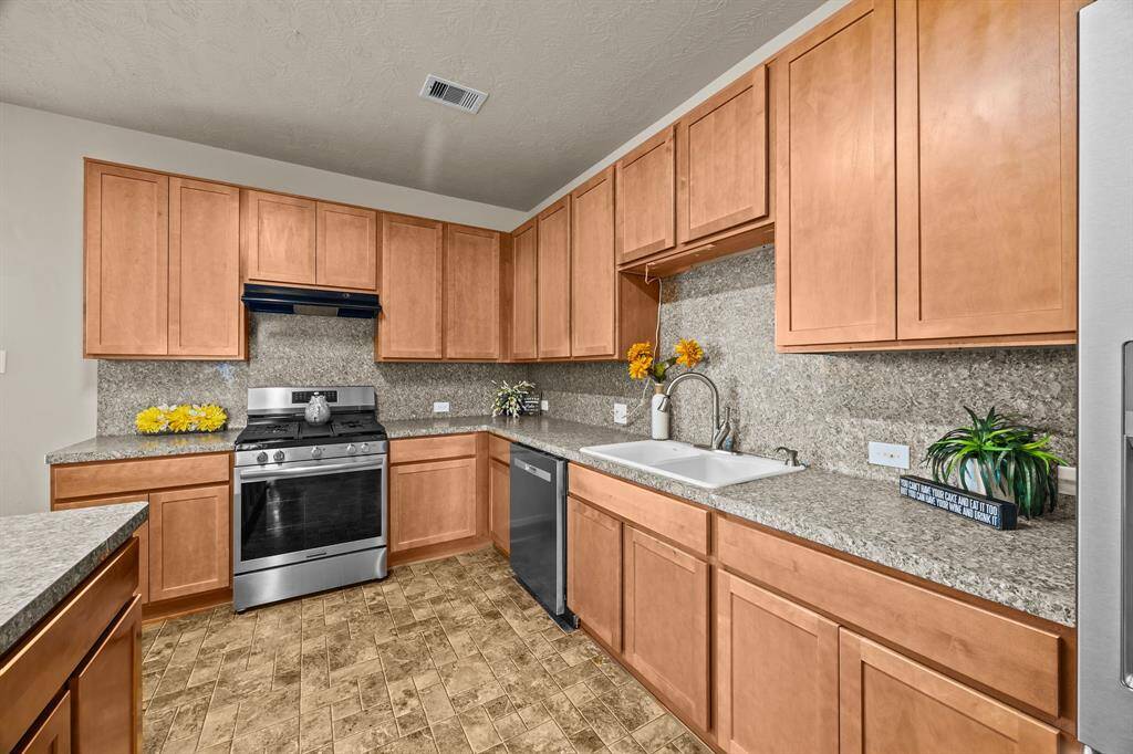 Abundant cabinet space enhances this kitchen's functionality and style.