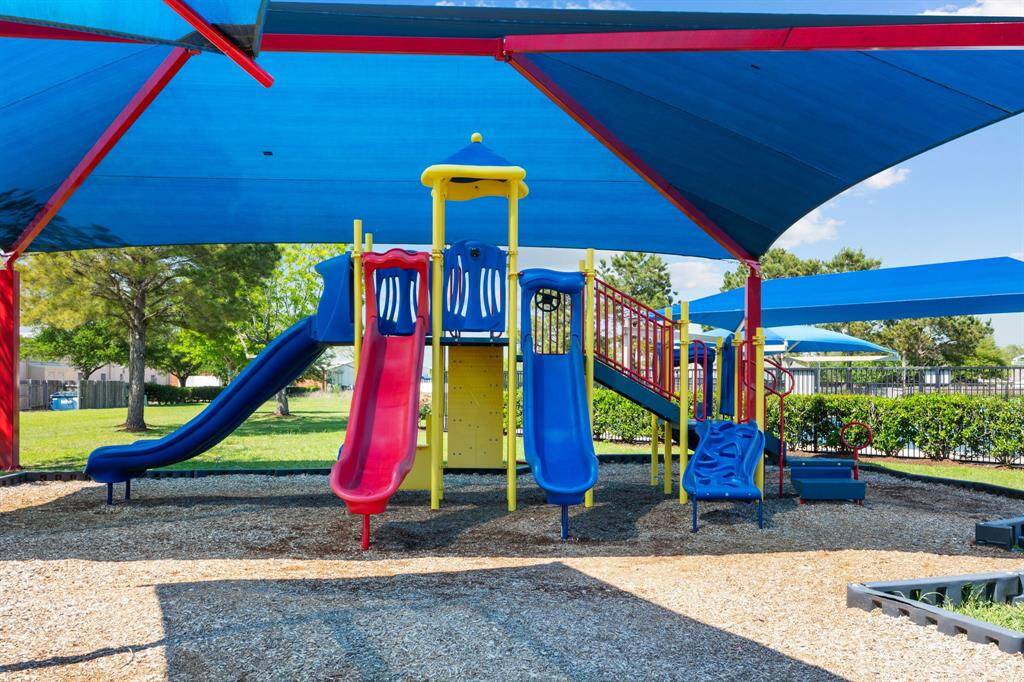 Family-friendly playground with ample shade in this charming neighborhood.