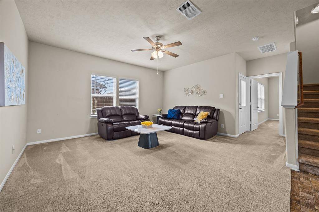Bright and spacious family room, perfect for accommodating all your furniture.