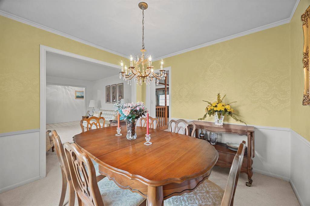 Dining Room opens into a bright living area, enhancing space and flow.