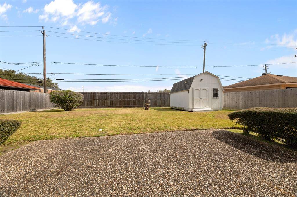 Large Concrete Patio, with plenty of Grass and a Large Storage Shed in your private Backyard.