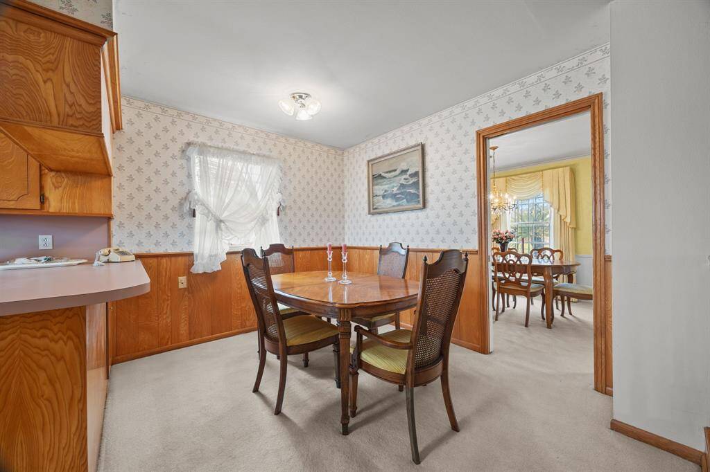 The Kitchen flows into the Breakfast Room, which opens to the Formal Dining Room. Makes for easy meal service & use of space.