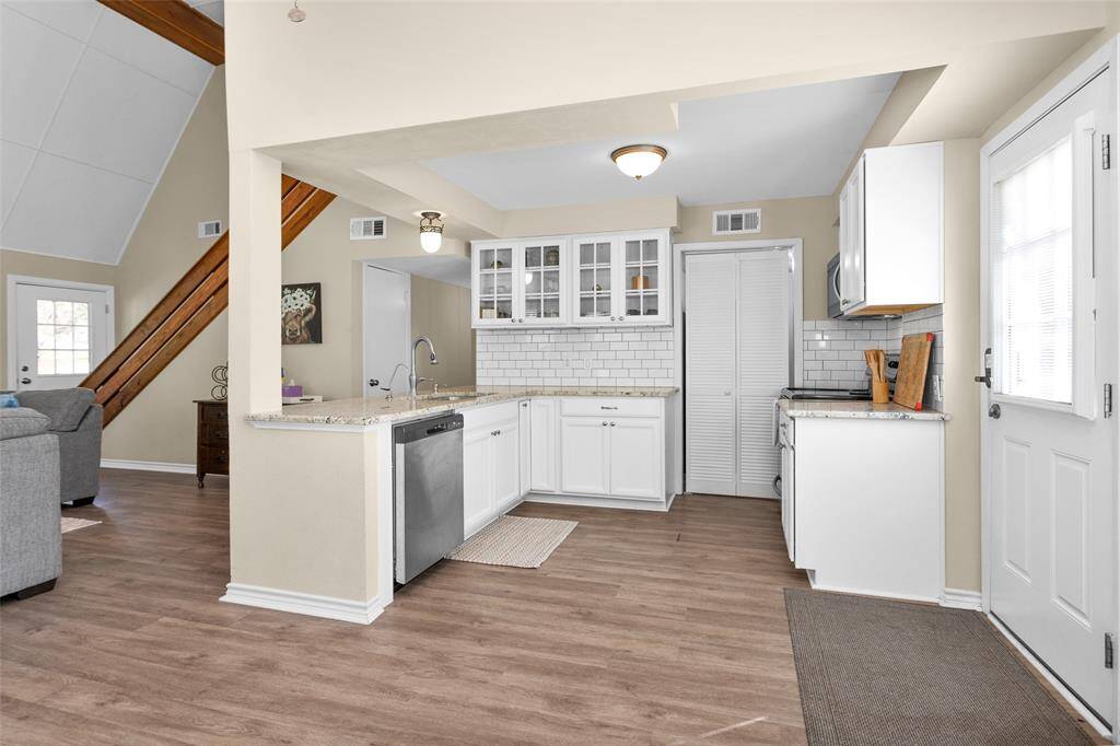 Refrigerator is located in the pantry.