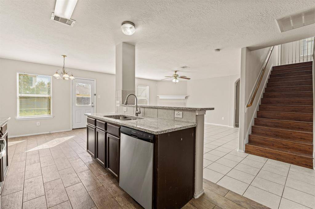 Your kitchen space flows seamlessly on easy care tile flooring.