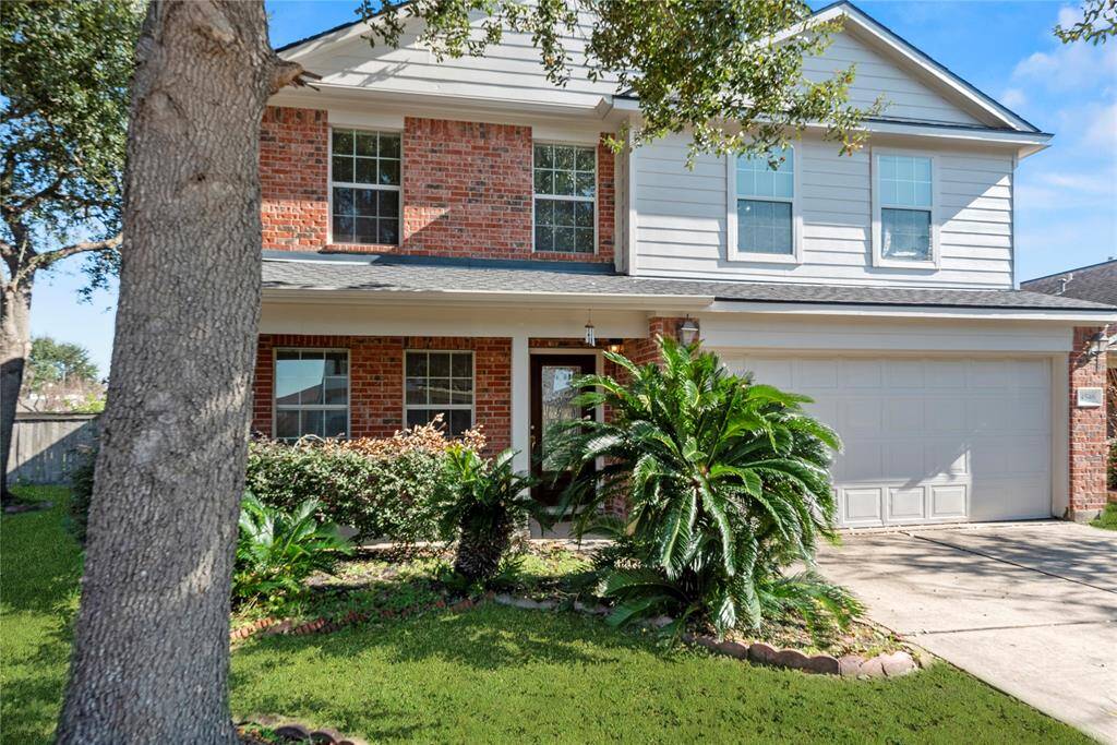 Mature trees and striking curb appeal combine to create a welcoming atmosphere.