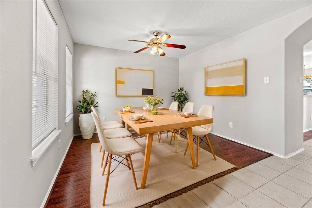 To the left of the entry is a large formal space which could be used as a gorgeous dining area or sitting room. The beautiful wood flooring adds warmth and elegance.