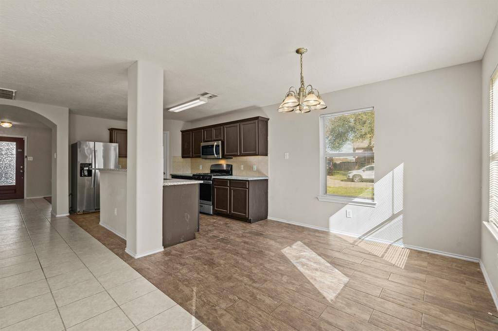 In this open concept design, the kitchen serves as the heart of the home, where meals are prepared, conversations flow, and memories are made.