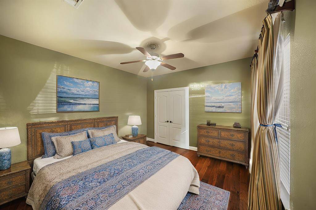 The downstairs secondary bedroom offers a comfortable and private space, perfect for guests or family members.