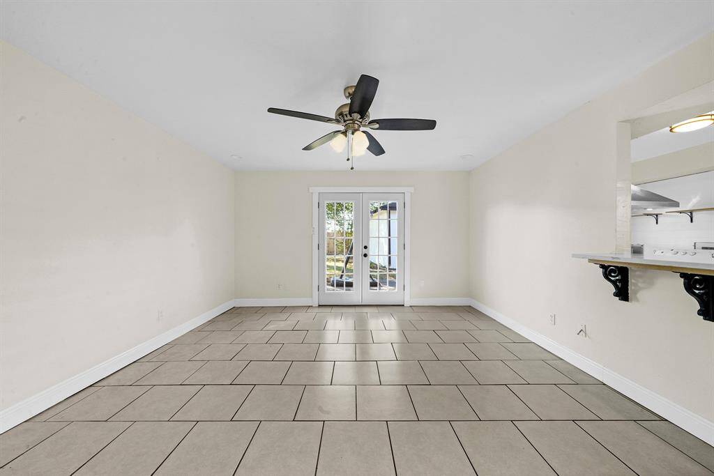 Living space with french doors to your backyard.