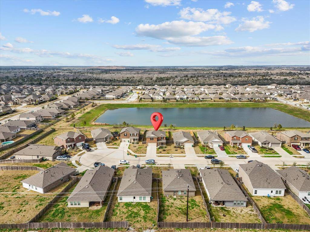 Prime location in a family-friendly neighborhood with scenic pond views and close proximity to I-45 and the beach.