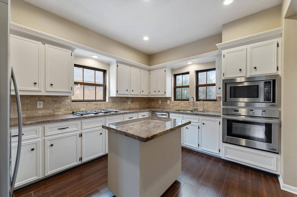 Plenty of storage and counterspace, natural light, breakfast bar at the island.