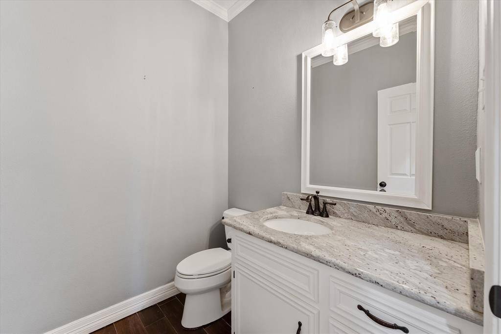 Guest bath with granite counters and lots of storage.