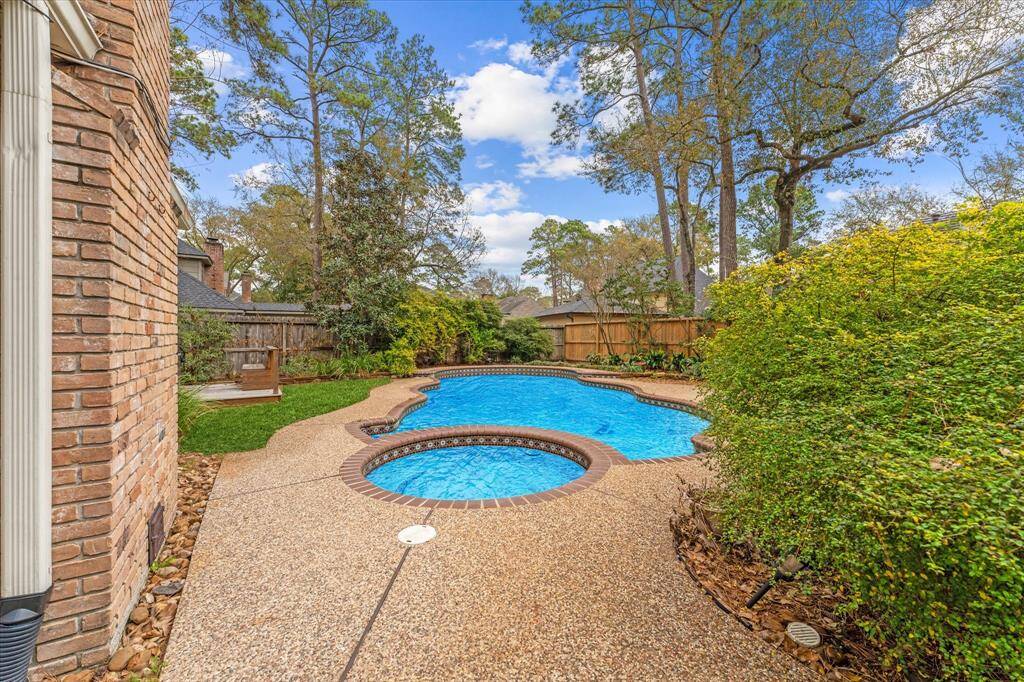 Backyard paradise with sparkling pool and spa.