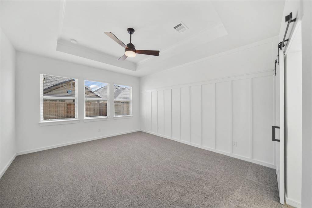 Spacious primary suite with feature wall (*Photo not of actual home and used for illustration purposes only.)