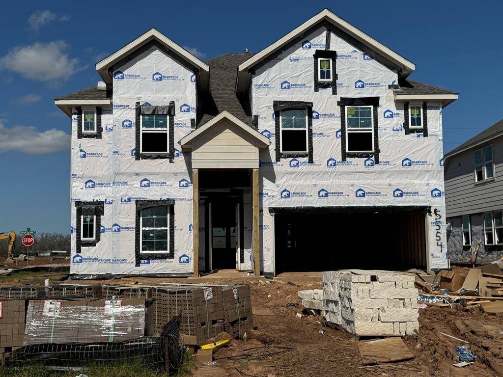 Two story home with 6 bedrooms, 4.5 baths, and 2 car garage.