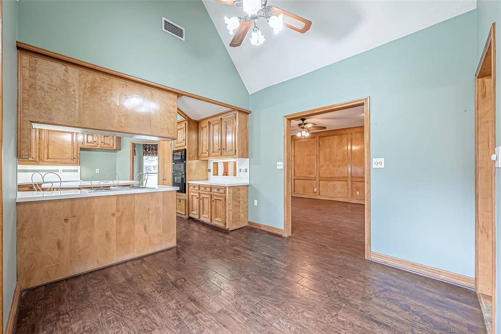 The kitchen flows effortlessly into a cozy breakfast area, ideal for casual dining.