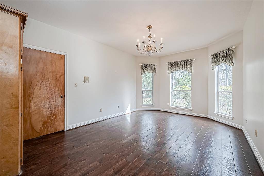 The spacious layout provides ample room for a home office, library, or reading nook.