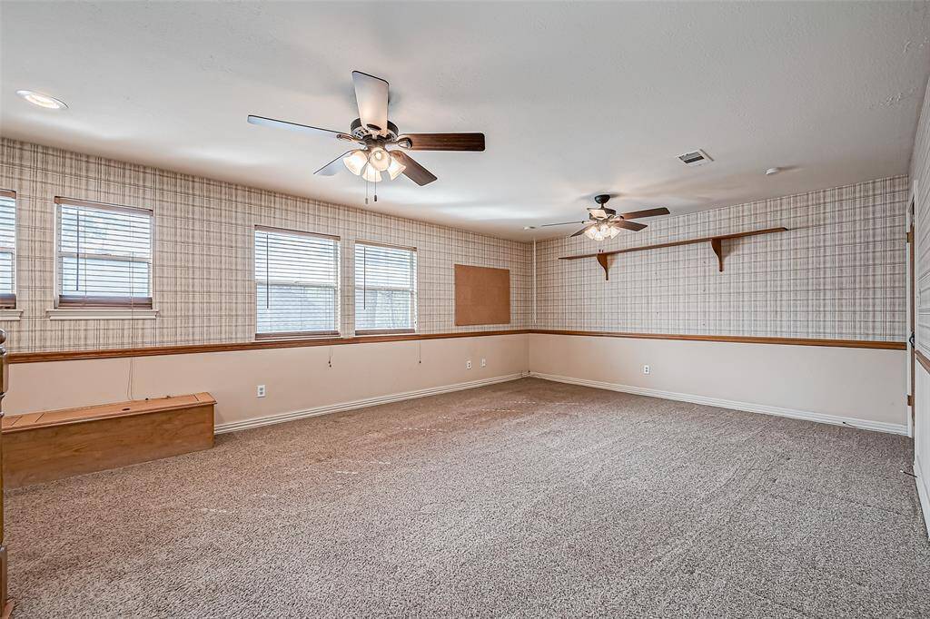 With ample square footage, this room offers endless possibilities for gaming or movie nights.