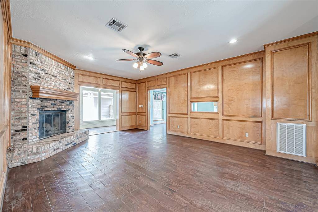 The extra-large family room is a true centerpiece, showcasing timeless block paneling.