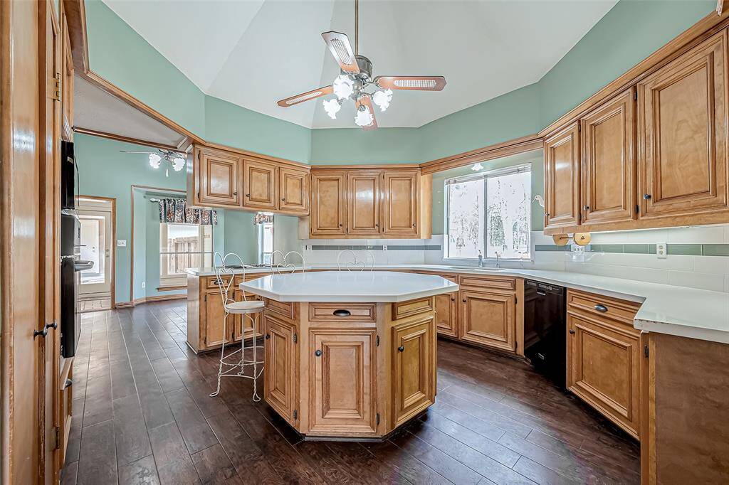 This charming kitchen offers a cozy well-designed space where cooking and gathering come together seamlessly.