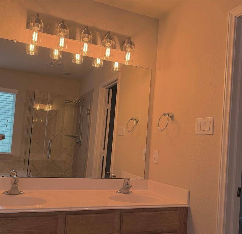 Master bathroom downstairs with double sink