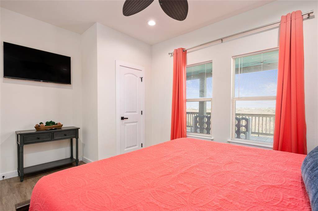 Spacious bedroom has LVP flooring