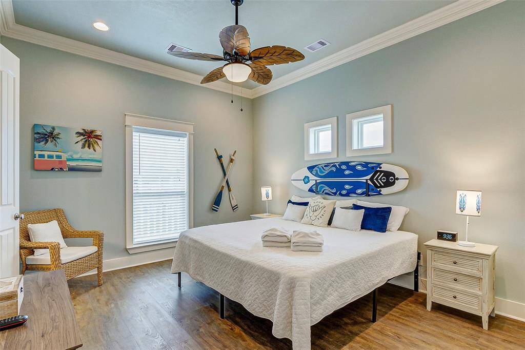 This spacious primary suite is light, bright, and airy and leads into a private primary bathroom.