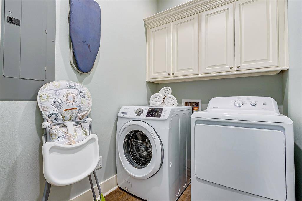 Large laundry room provides space for additional storage and amenities.