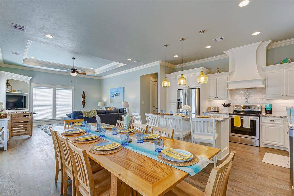 This luxe property has LVP flooring, crown molding, and granite countertops throughout.
