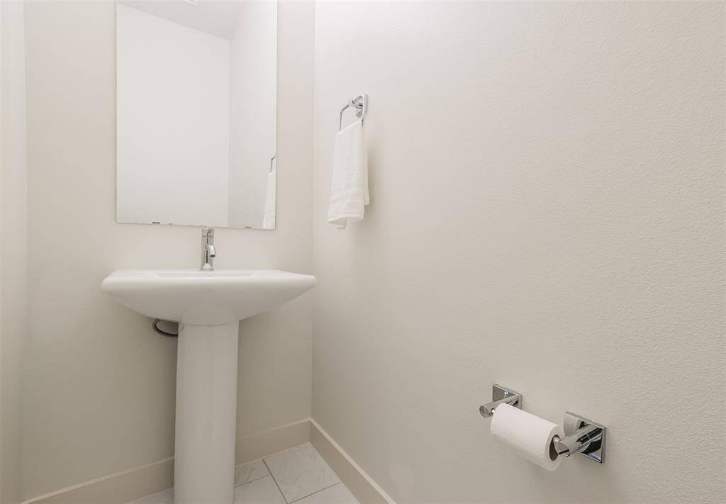 Introducing a conveniently located half bath on the second level, ensuring comfort and ease for you and your guests.